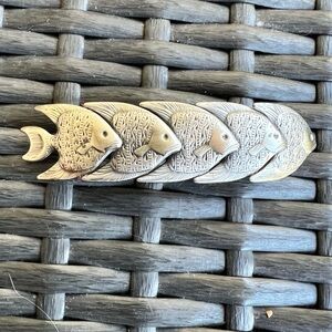 Silver five fish swimming hair clip. Closure made in France. 3.5” long 1” wide.